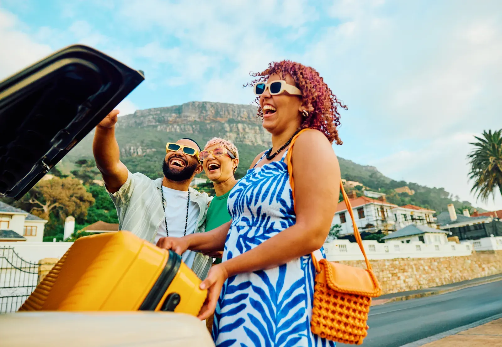 Smiling friends taking a selfie together on vacation
