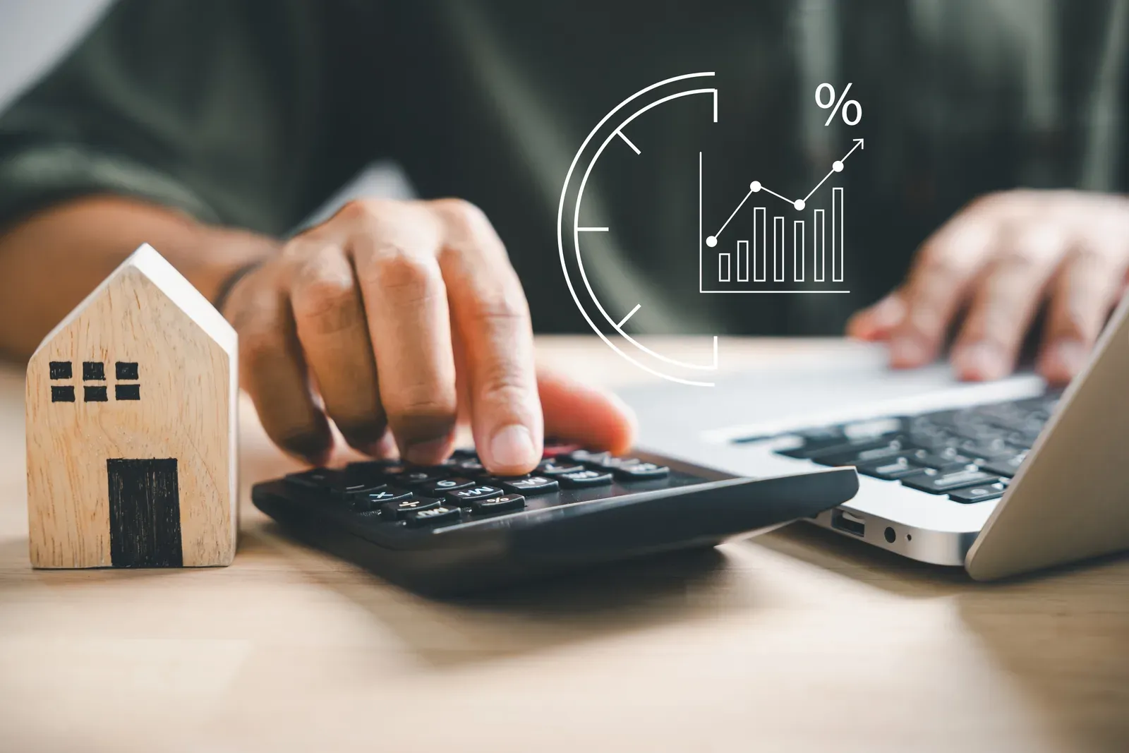Man's hand pressing calculator keys, running the real math on costs