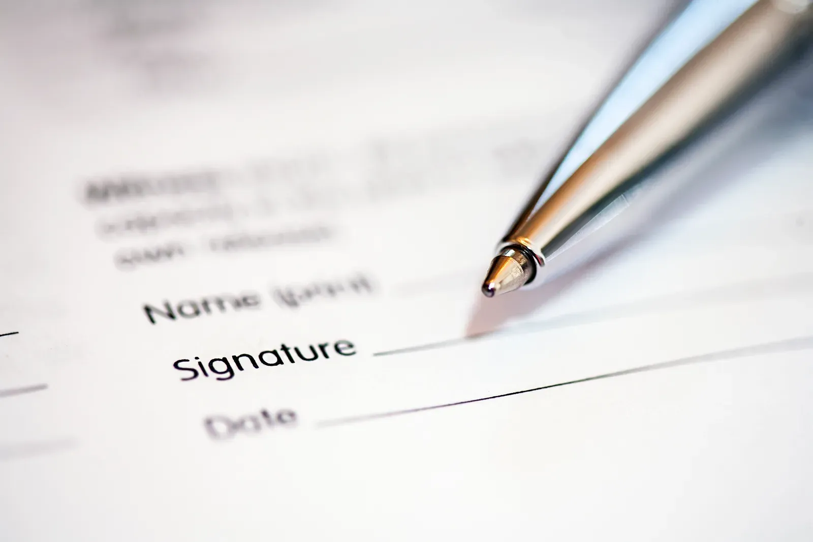 Handwritten signature on paper, the heart of any filming consent release