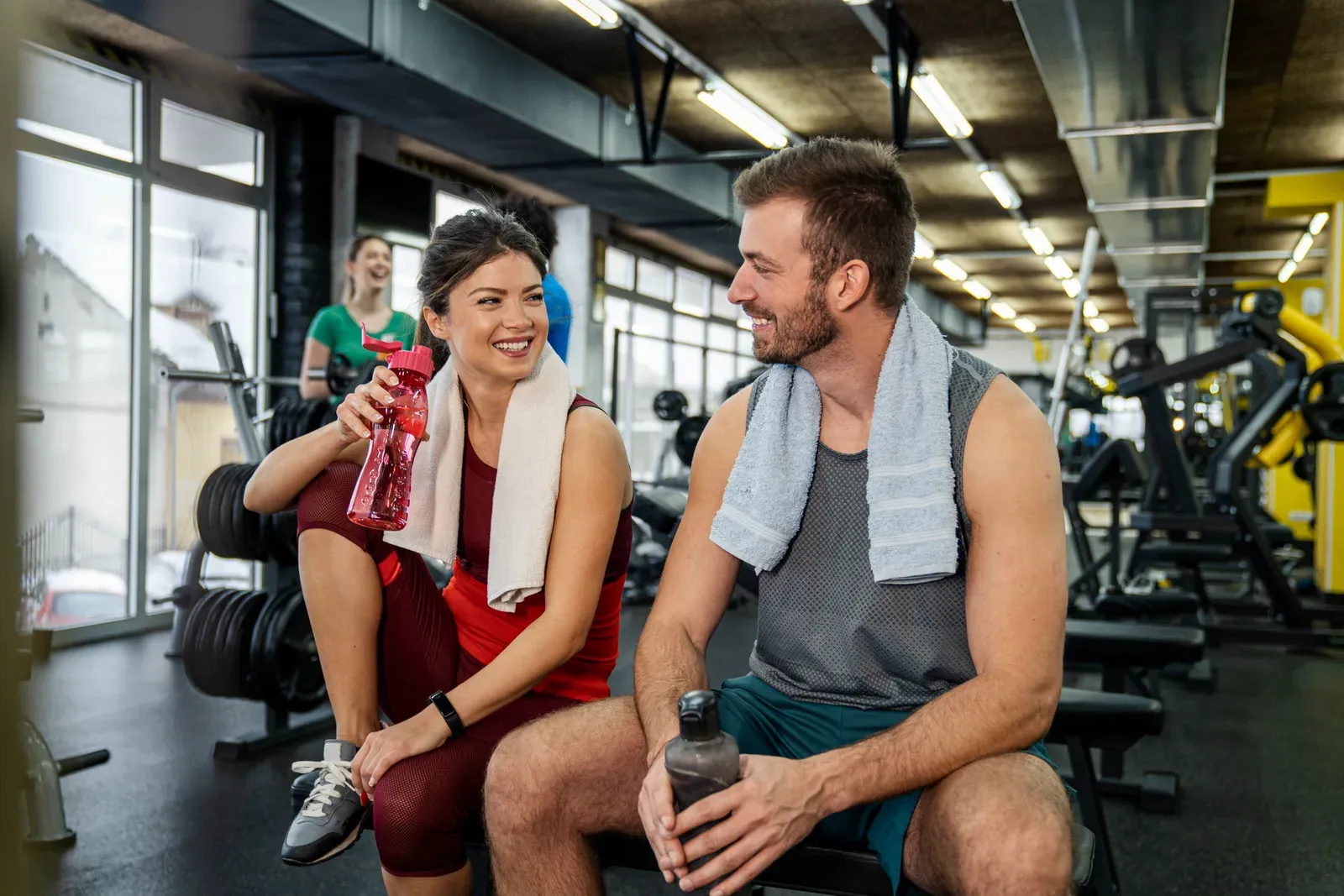 Couple resting after a gym workout, the kind of clients new trainers look for