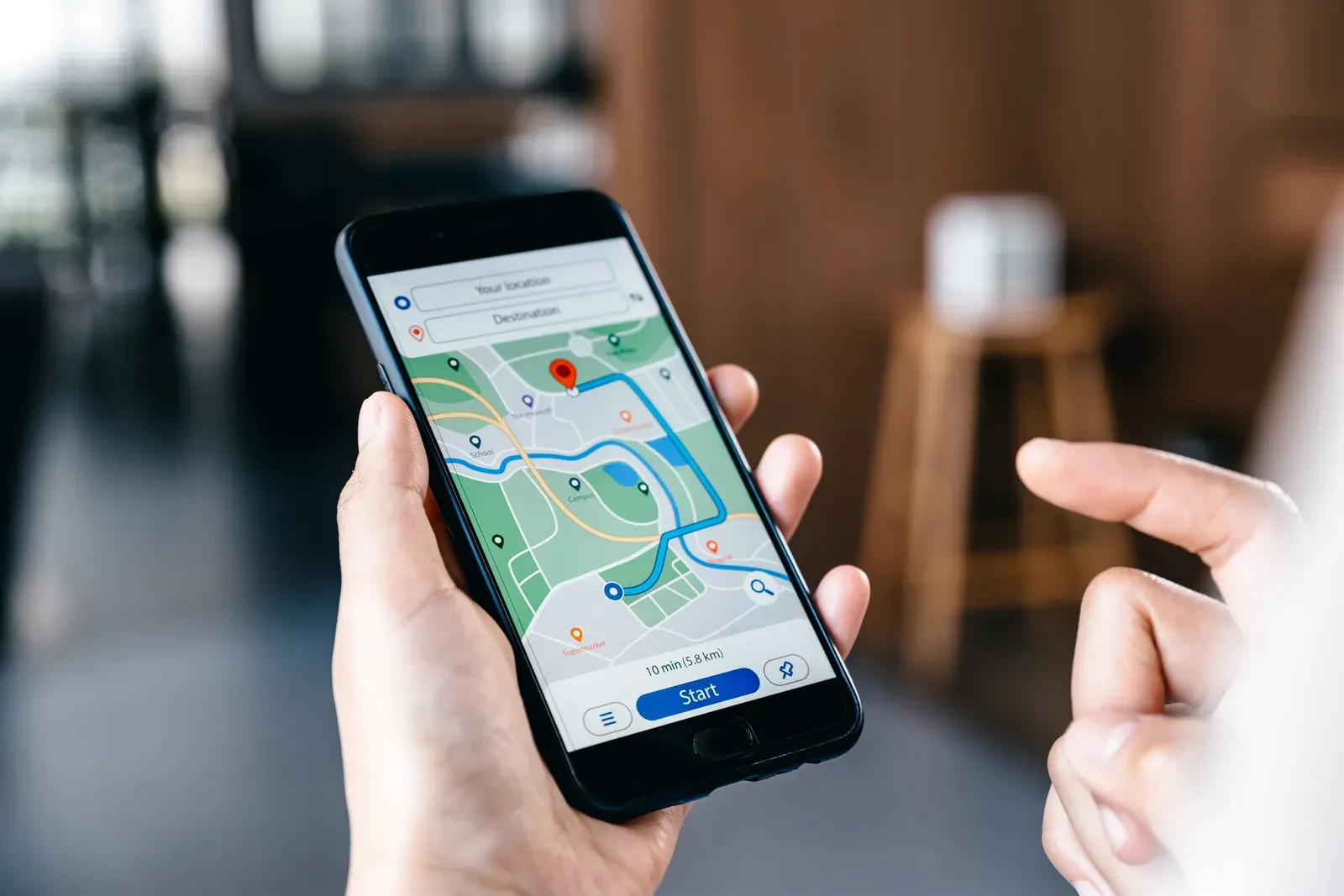 Thumb scrolling a map app search results list on a smartphone