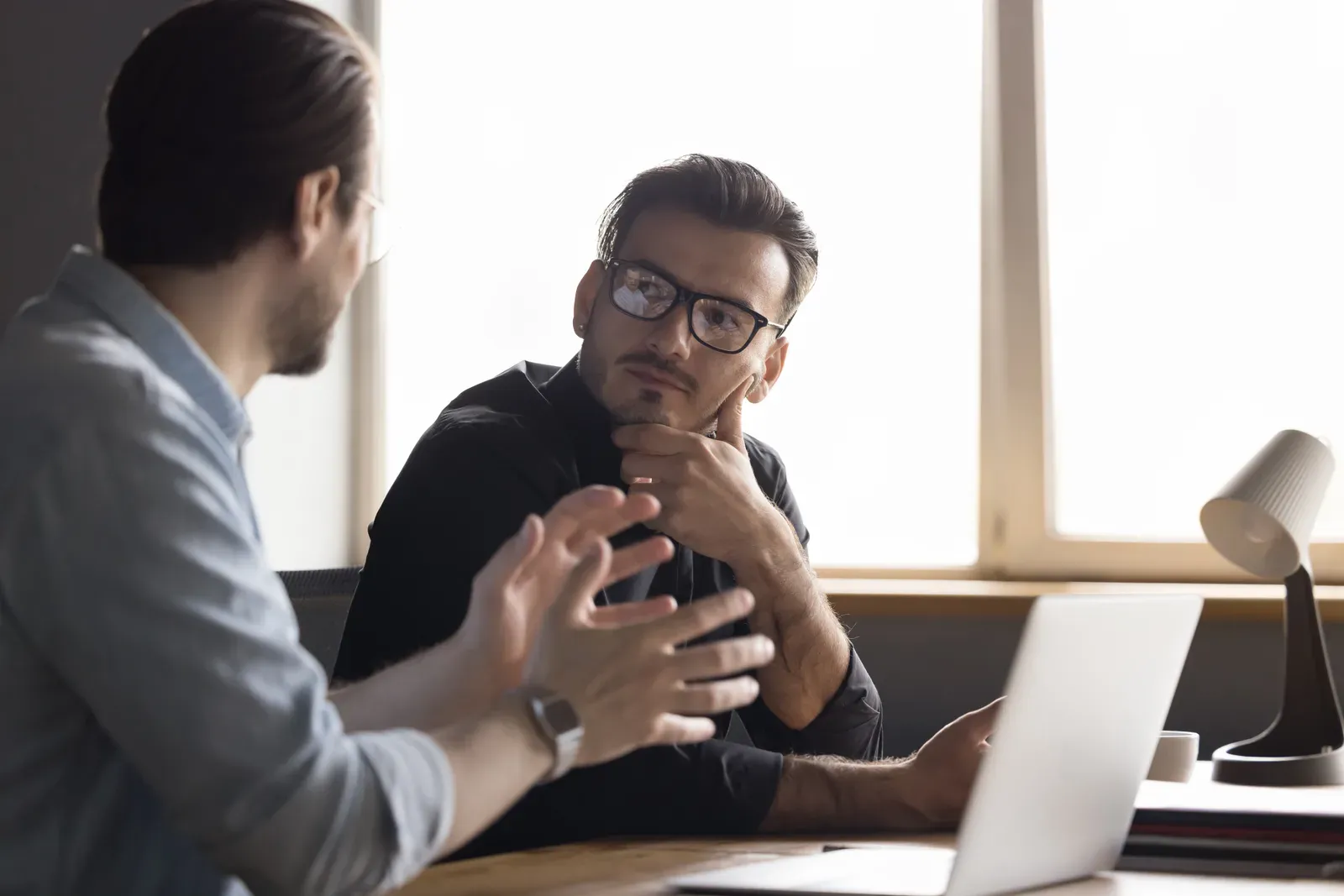 Businessman listening closely to professional advice during a one on one consultation