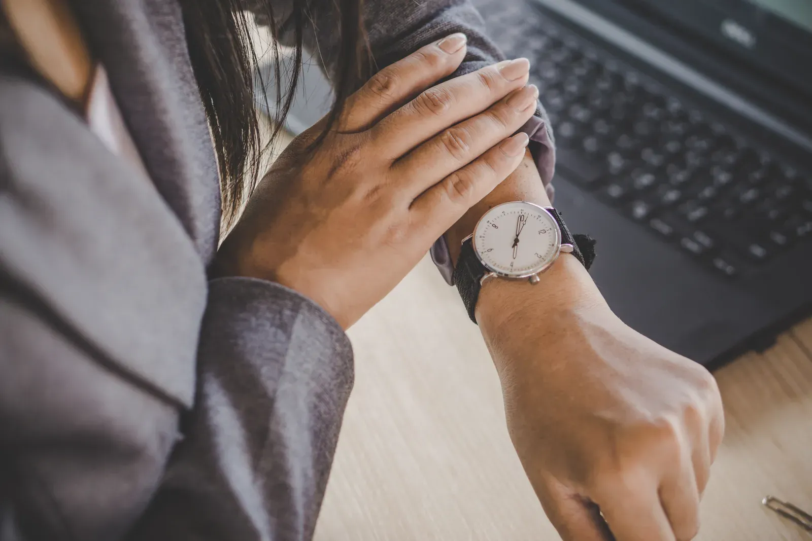 Businesswoman checking her watch while waiting on a late arrival