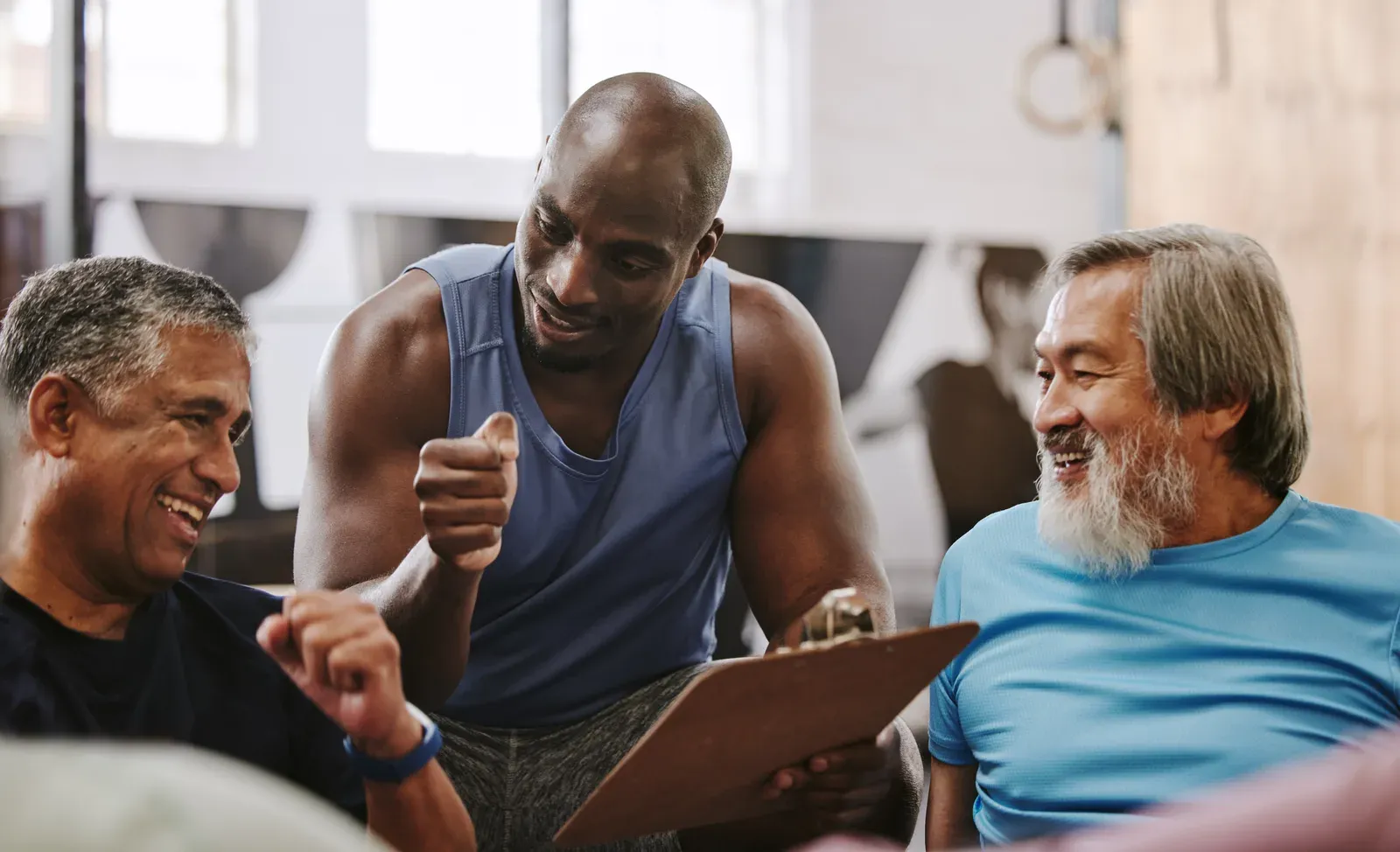 Coach talking older clients through their training checklist