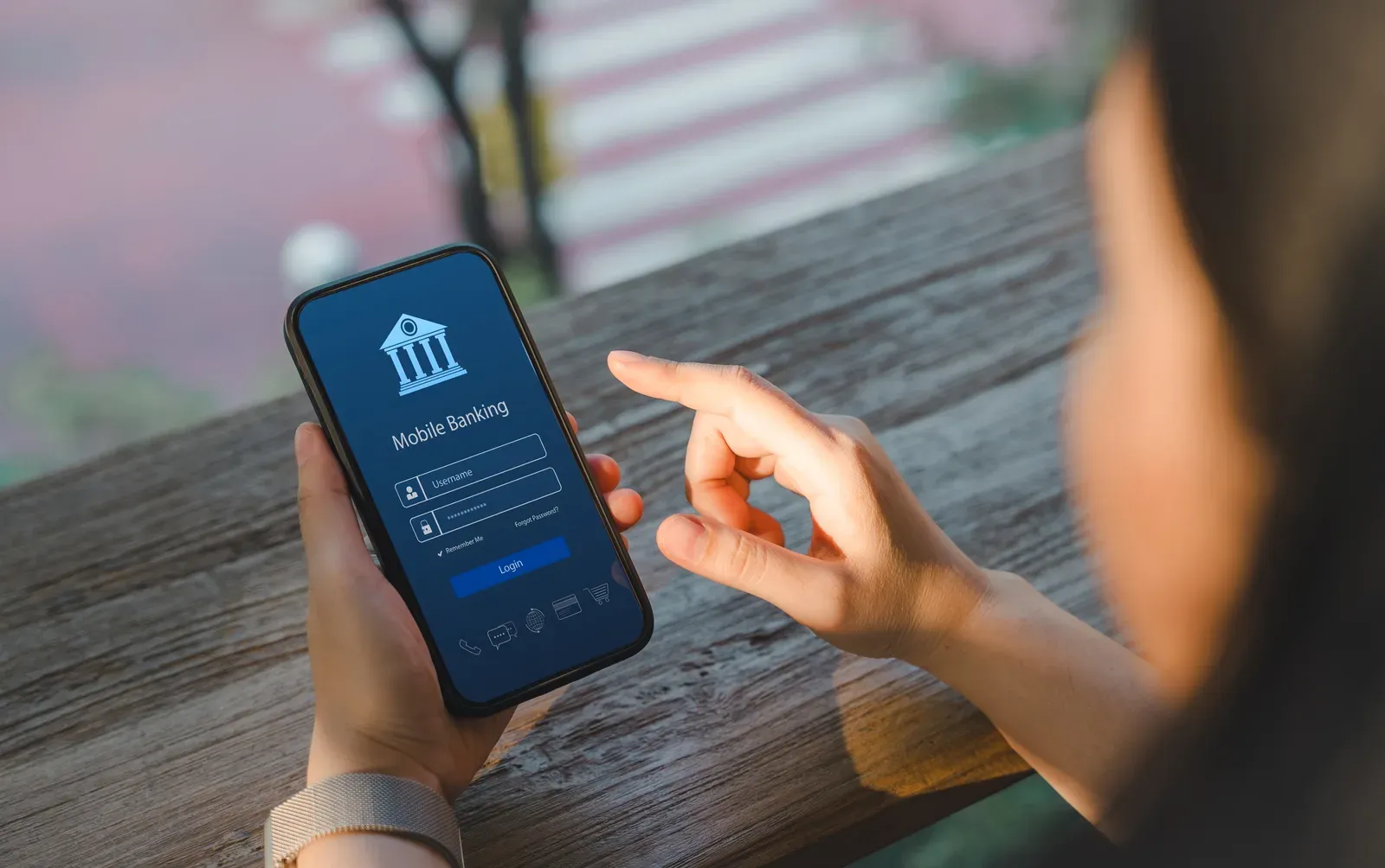 Mobile banking app open on a smartphone, keeping business funds separate