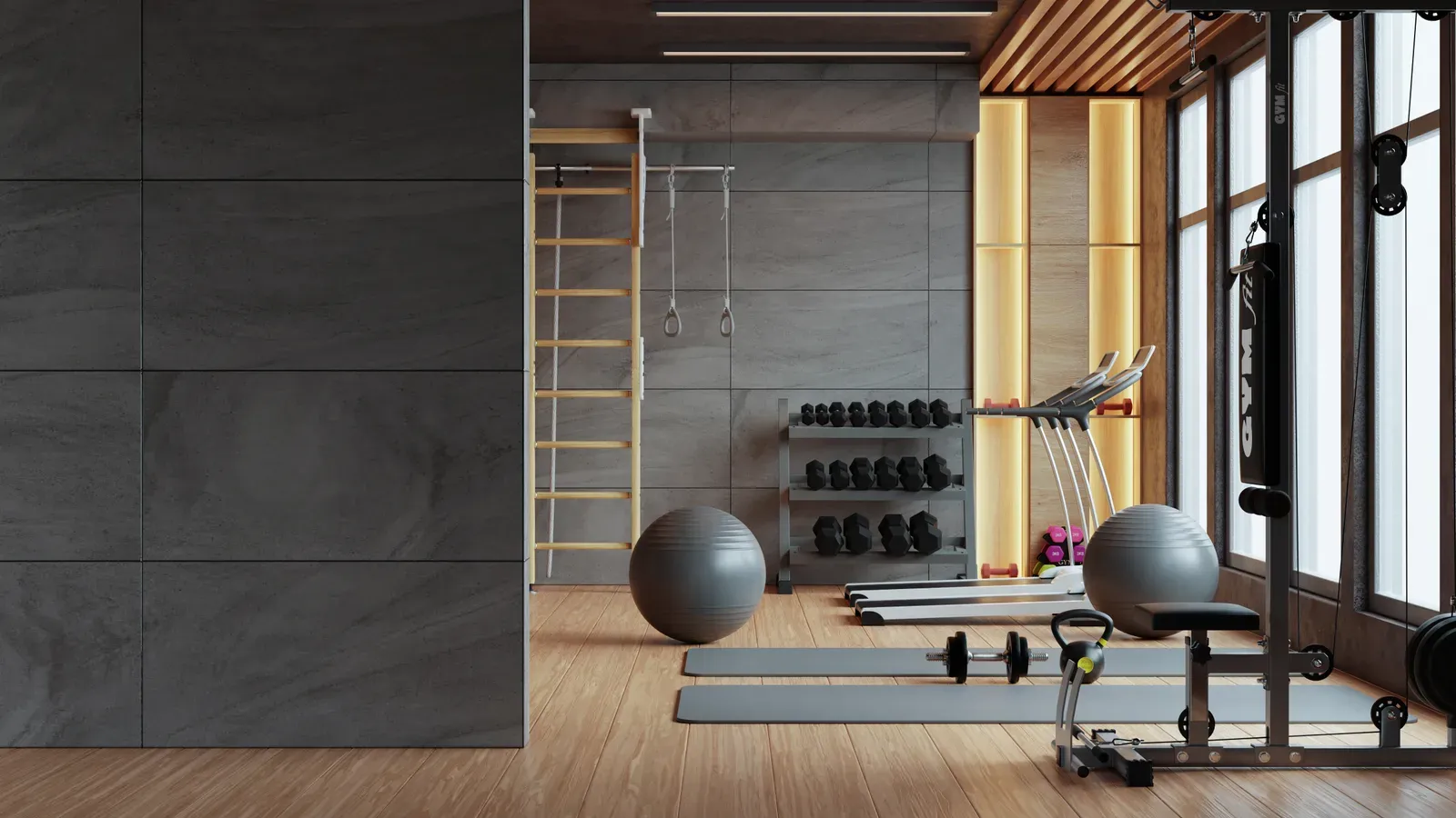 An empty, modern fitness room with equipment along the wall